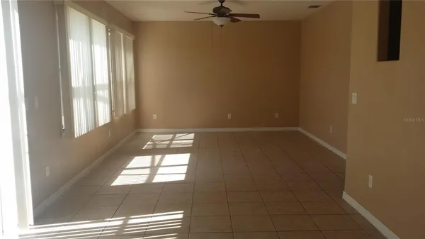 a view of empty room with windows