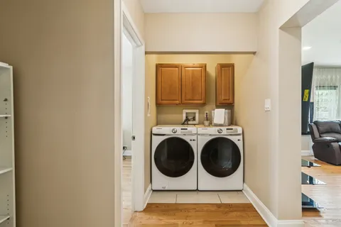 a bathroom with a toilet and a mirror