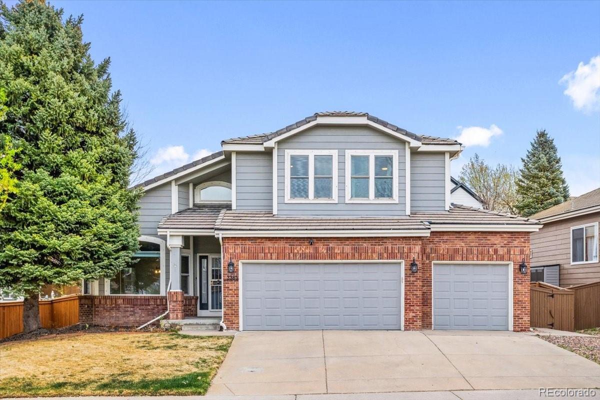 a front view of a house with a garage