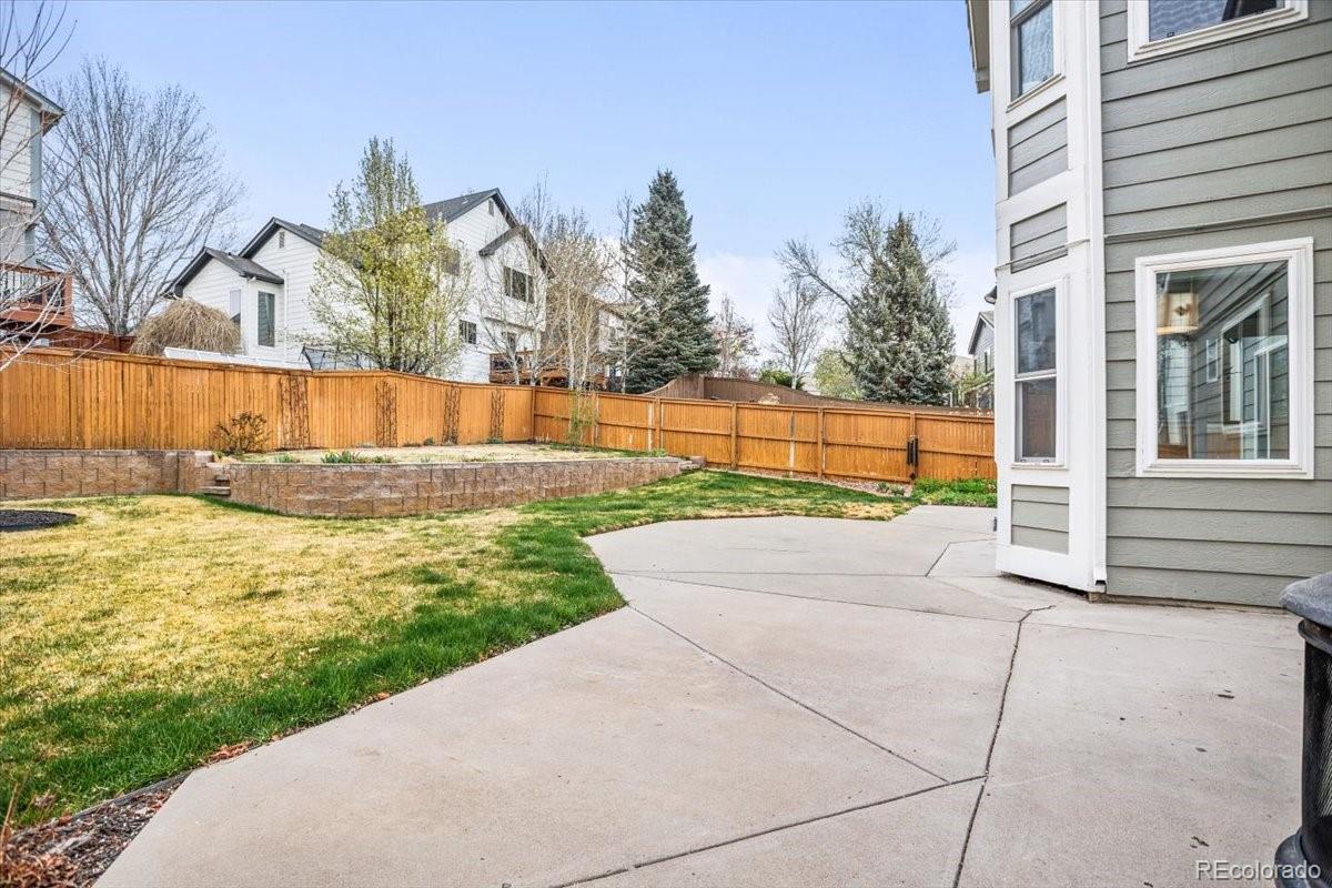 3385 White Oak Lane Highlands Ranch, CO 80129 - Photo 33 of 36 a view of swimming pool with an outdoor space and seating area
