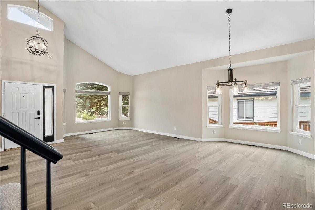 3385 White Oak Lane Highlands Ranch, CO 80129 - Photo 4 of 36 a view of an empty room with window and wooden floor