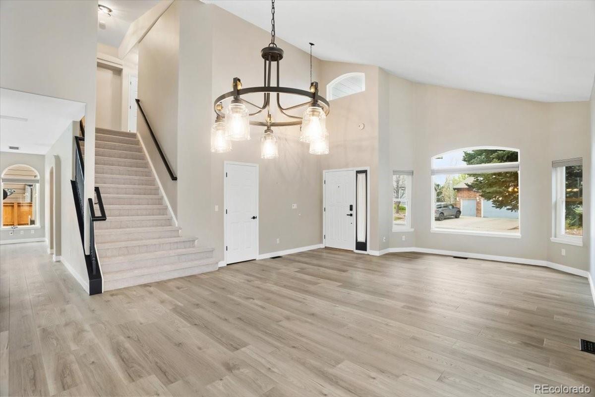 3385 White Oak Lane Highlands Ranch, CO 80129 - Photo 5 of 36 a view of empty room with wooden floor