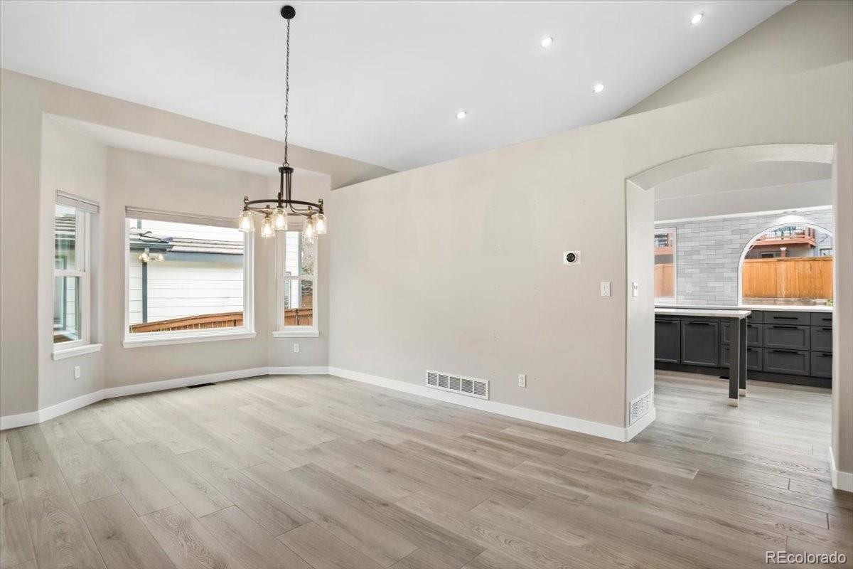 3385 White Oak Lane Highlands Ranch, CO 80129 - Photo 6 of 36 a view of an empty room with window and wooden floor