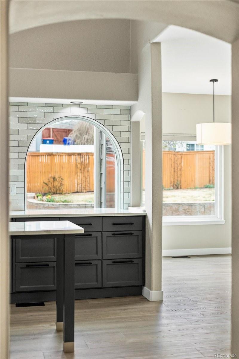3385 White Oak Lane Highlands Ranch, CO 80129 - Photo 7 of 36 a bathroom with a sink a mirror and a window