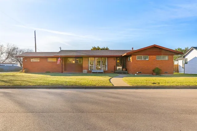 a view of swimming pool with a yard