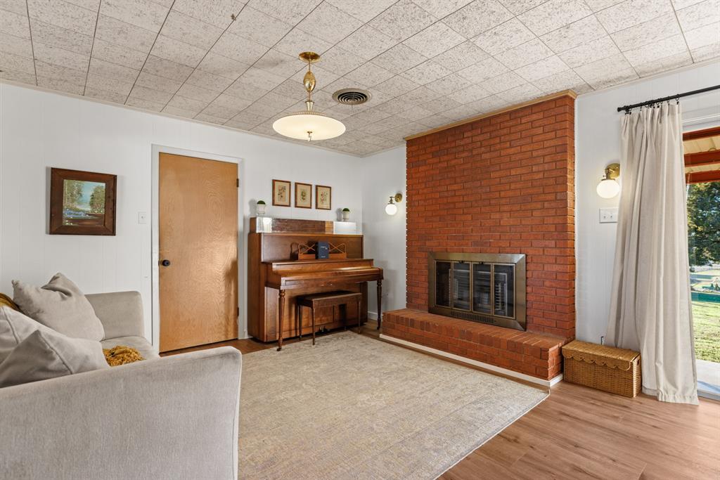 910 South Harrison Street West, TX 76691 - Photo 11 of 39 a living room with furniture and a fireplace