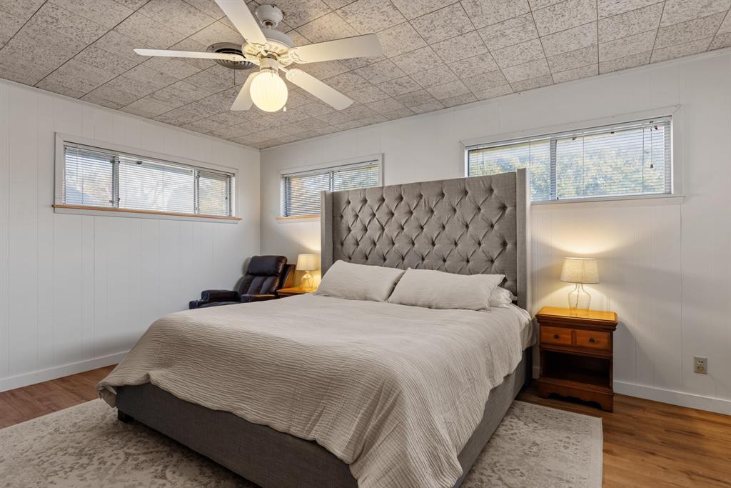 910 South Harrison Street West, TX 76691 - Photo 19 of 39 a bedroom with a bed and a ceiling fan