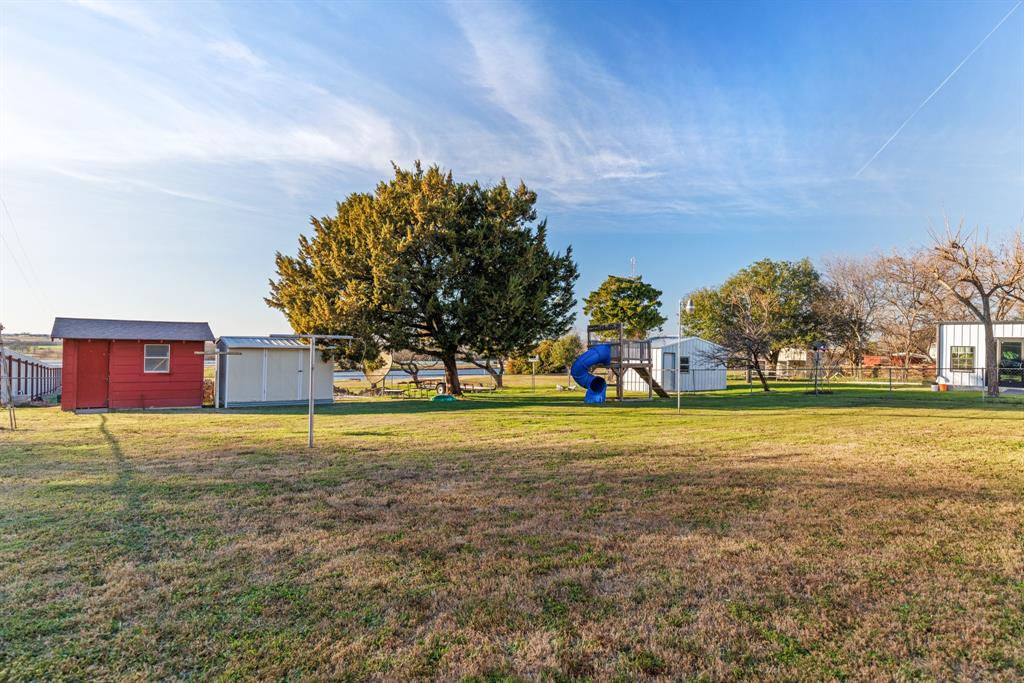 910 South Harrison Street West, TX 76691 - Photo 31 of 39 a view of a house with a big yard