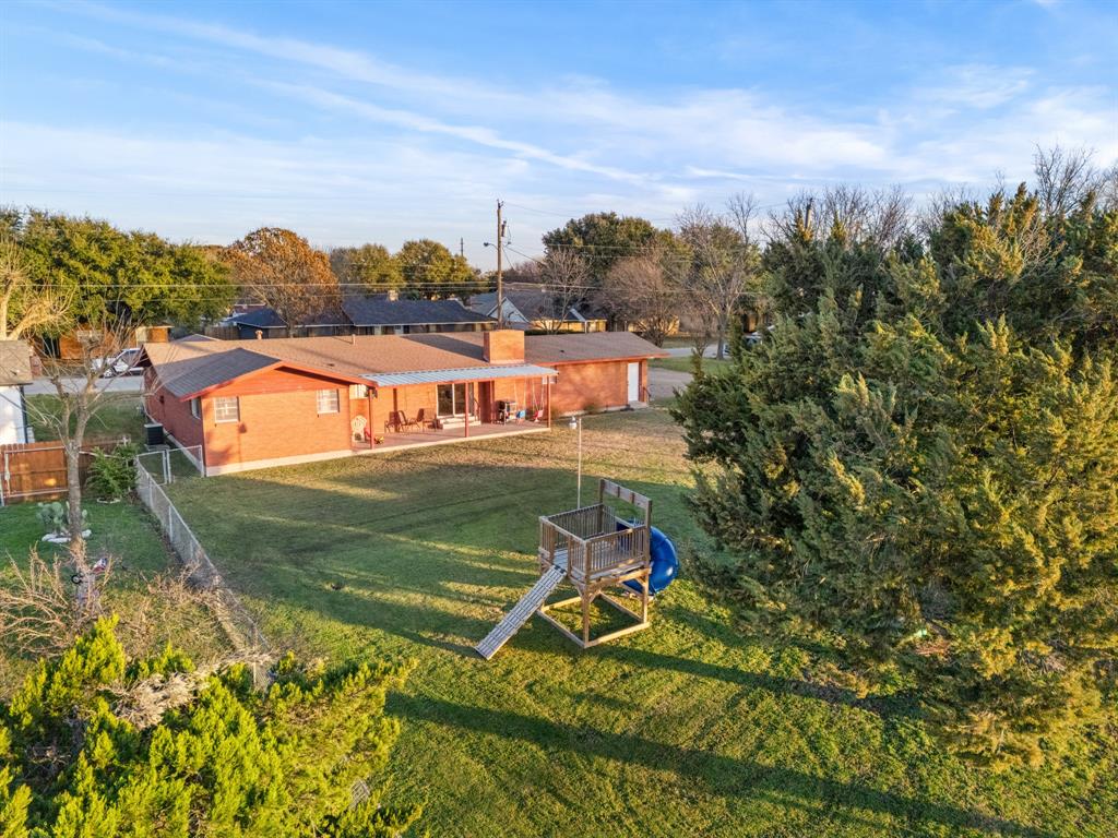 910 South Harrison Street West, TX 76691 - Photo 32 of 39 an aerial view of a house with a big yard