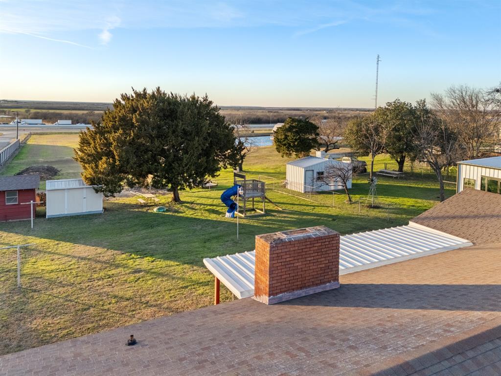 910 South Harrison Street West, TX 76691 - Photo 33 of 39 an aerial view of a house with a yard basket ball court and outdoor seating