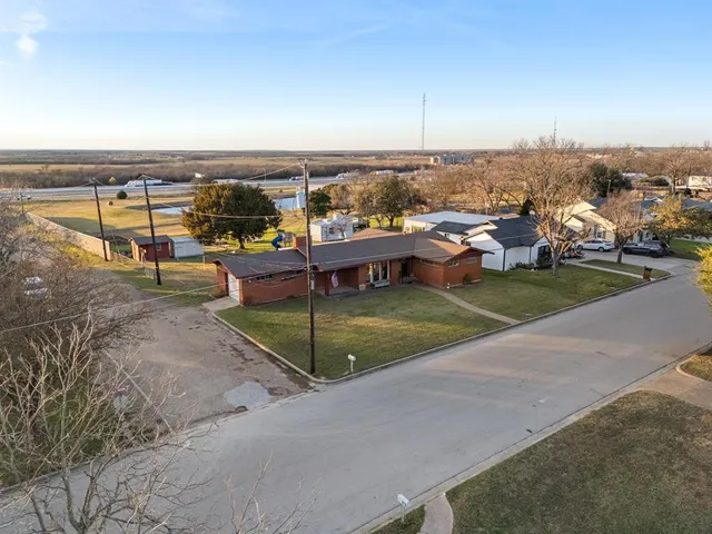 an aerial view of a house with a ocean view