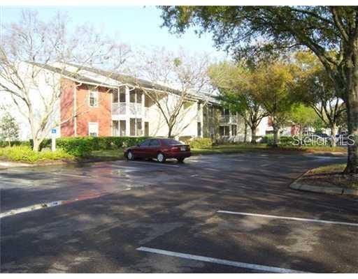 209 Lake Brook Circle, Unit 206 Brandon, FL 33511 - Photo 3 of 5 a view of street with parked cars