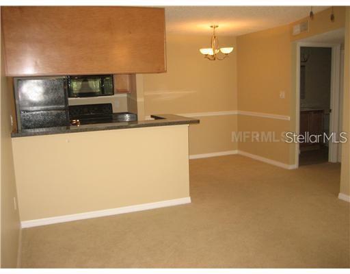 209 Lake Brook Circle, Unit 206 Brandon, FL 33511 - Photo 4 of 5 a view of a living room with a flat screen tv