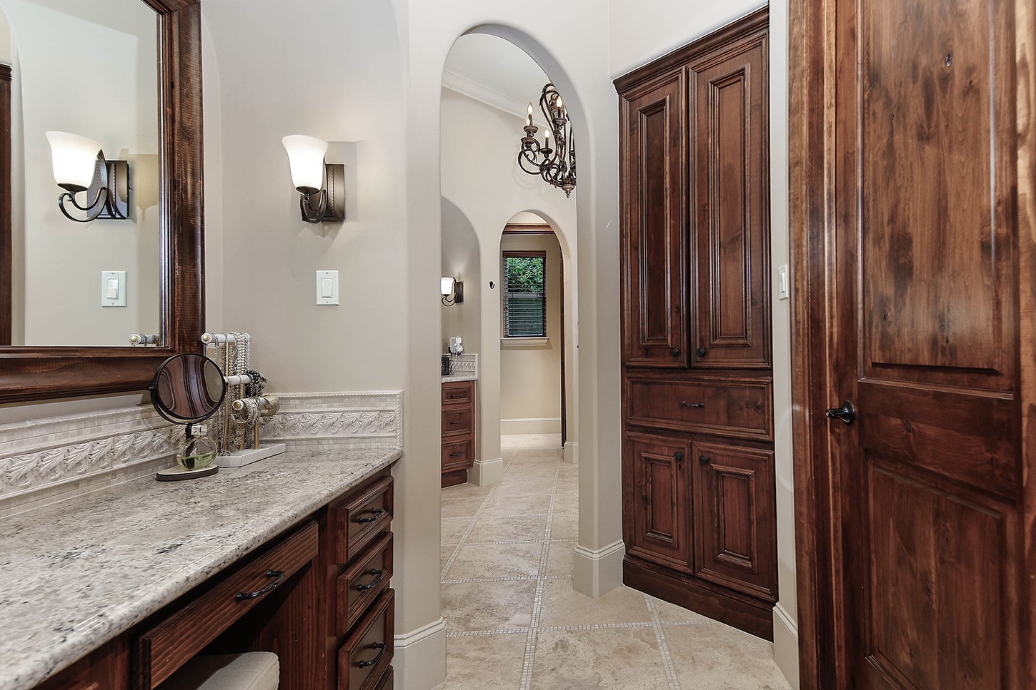 119 Angel Leaf Road The Woodlands, TX 77380 - Photo 30 of 50 a bathroom with a granite countertop sink and a mirror