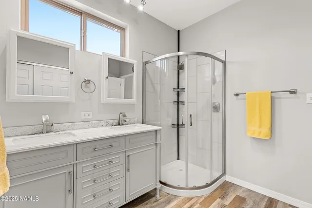 a bathroom with a granite countertop sink mirror and vanity