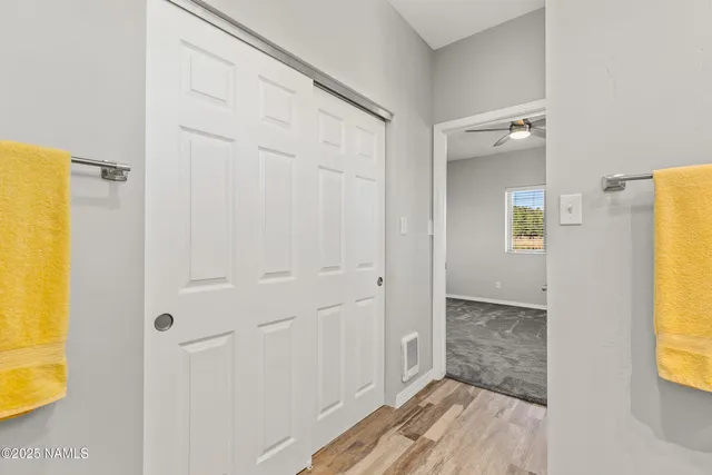 a view of a bathroom with a sink and a mirror