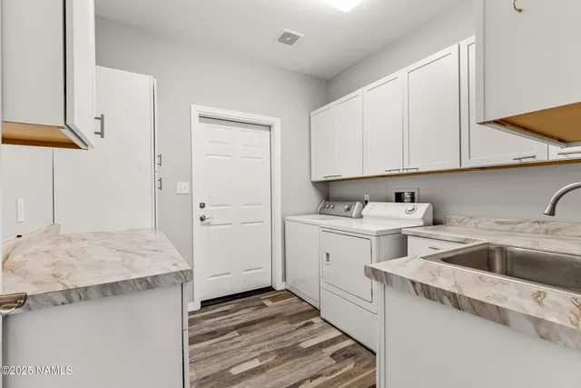 a view of a kitchen sink and cabinets