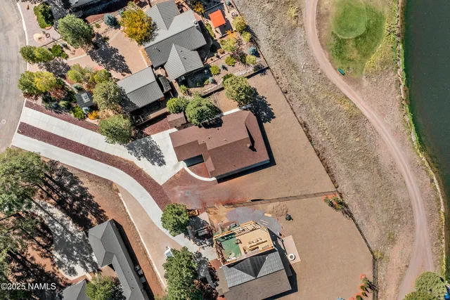 an aerial view of a house with a swimming pool