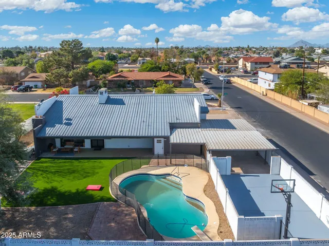 a view of a house with swimming pool