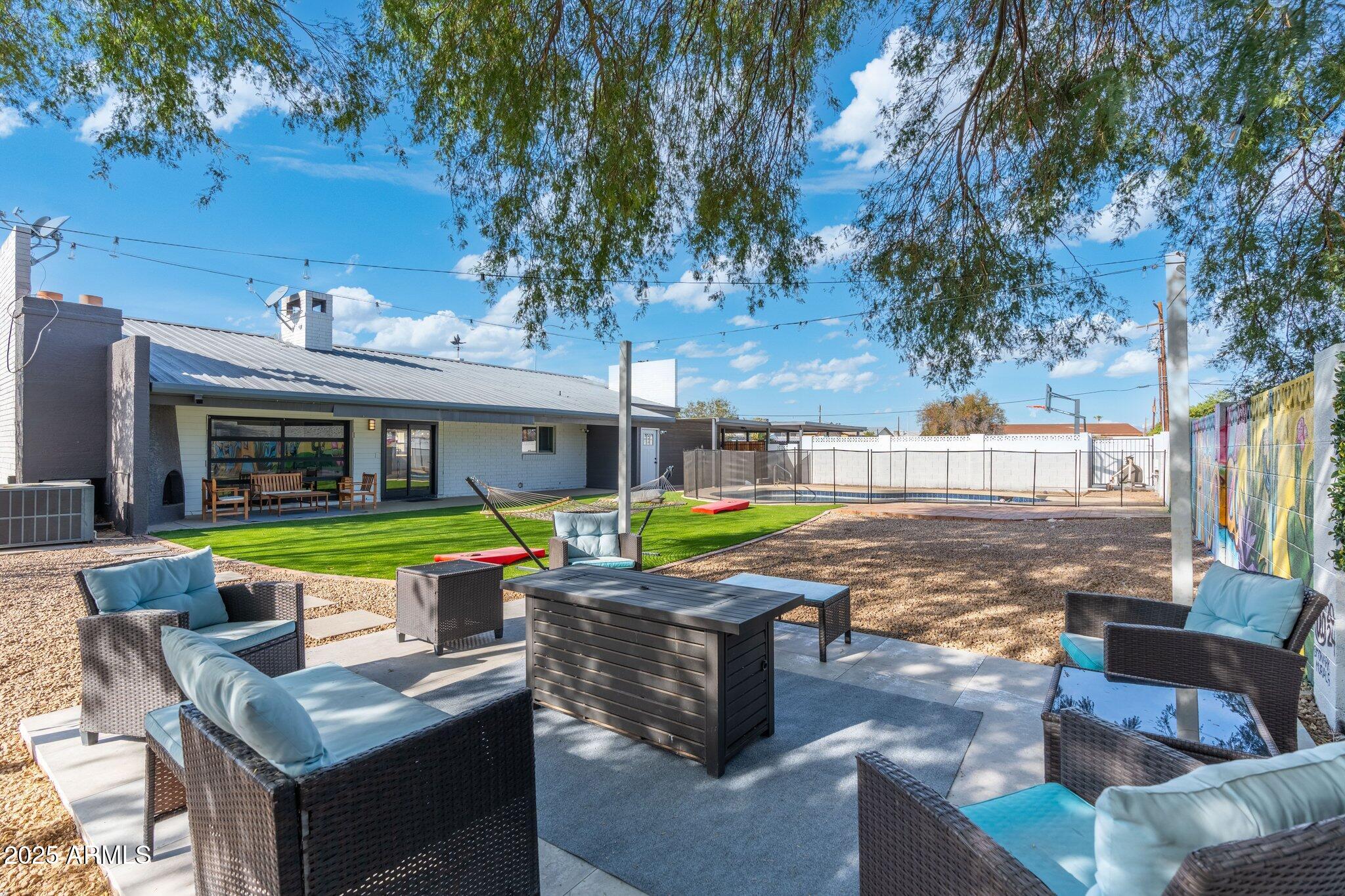 1759 North Spring Circle Mesa, AZ 85203 - Photo 28 of 69 a view of an house with swimming pool and sitting area