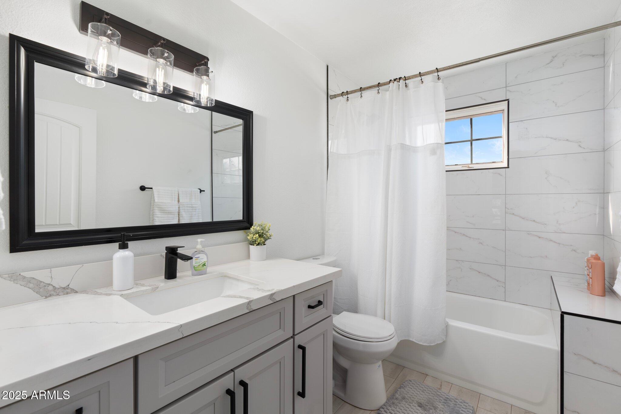 1759 North Spring Circle Mesa, AZ 85203 - Photo 41 of 69 a bathroom with a sink a toilet and shower