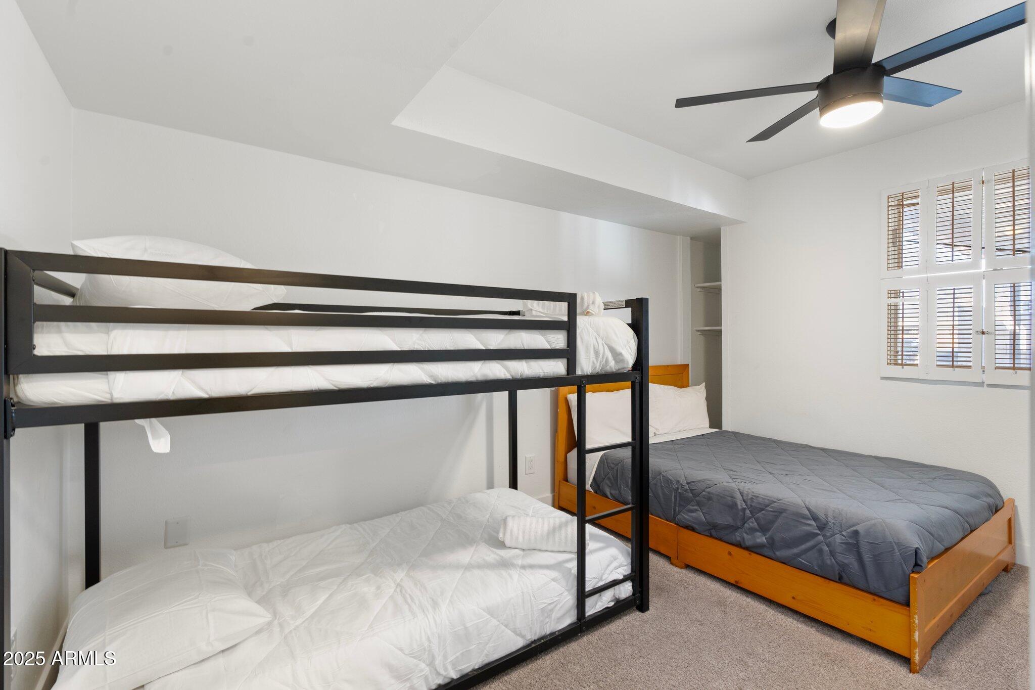 1759 North Spring Circle Mesa, AZ 85203 - Photo 46 of 69 a bedroom with a bed and lamp