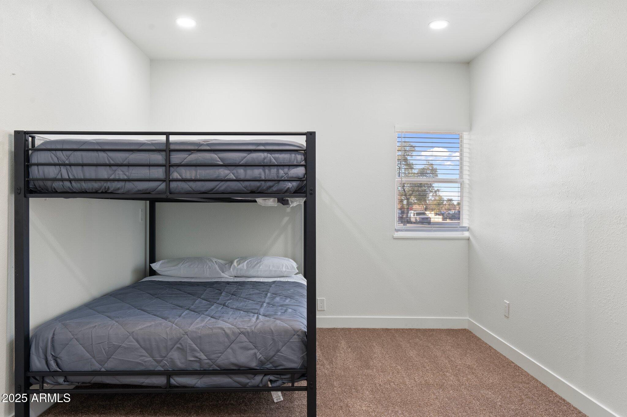 1759 North Spring Circle Mesa, AZ 85203 - Photo 48 of 69 a bedroom with a bed and a window