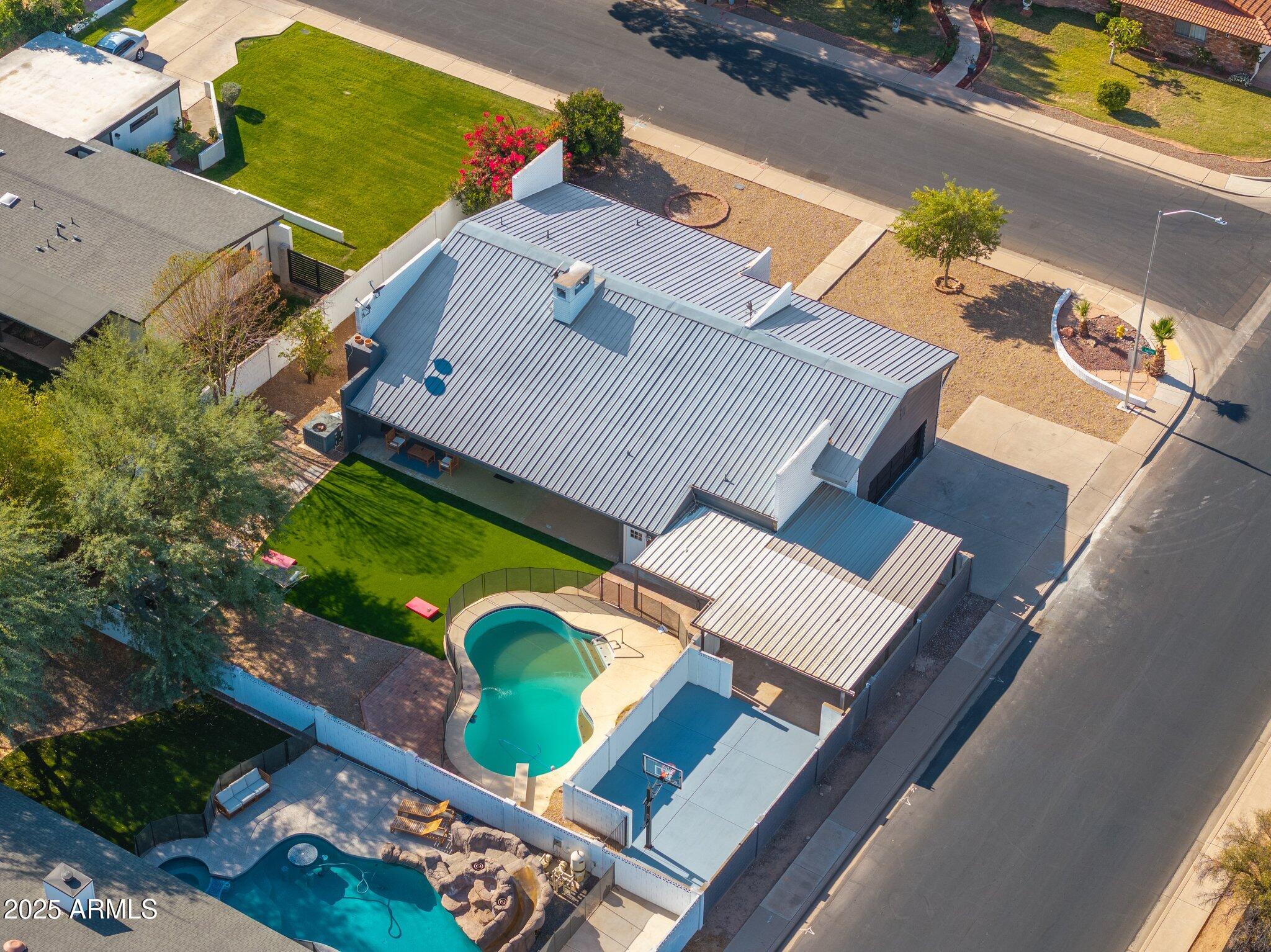 1759 North Spring Circle Mesa, AZ 85203 - Photo 6 of 69 an aerial view of a house with a garden and swimming pool