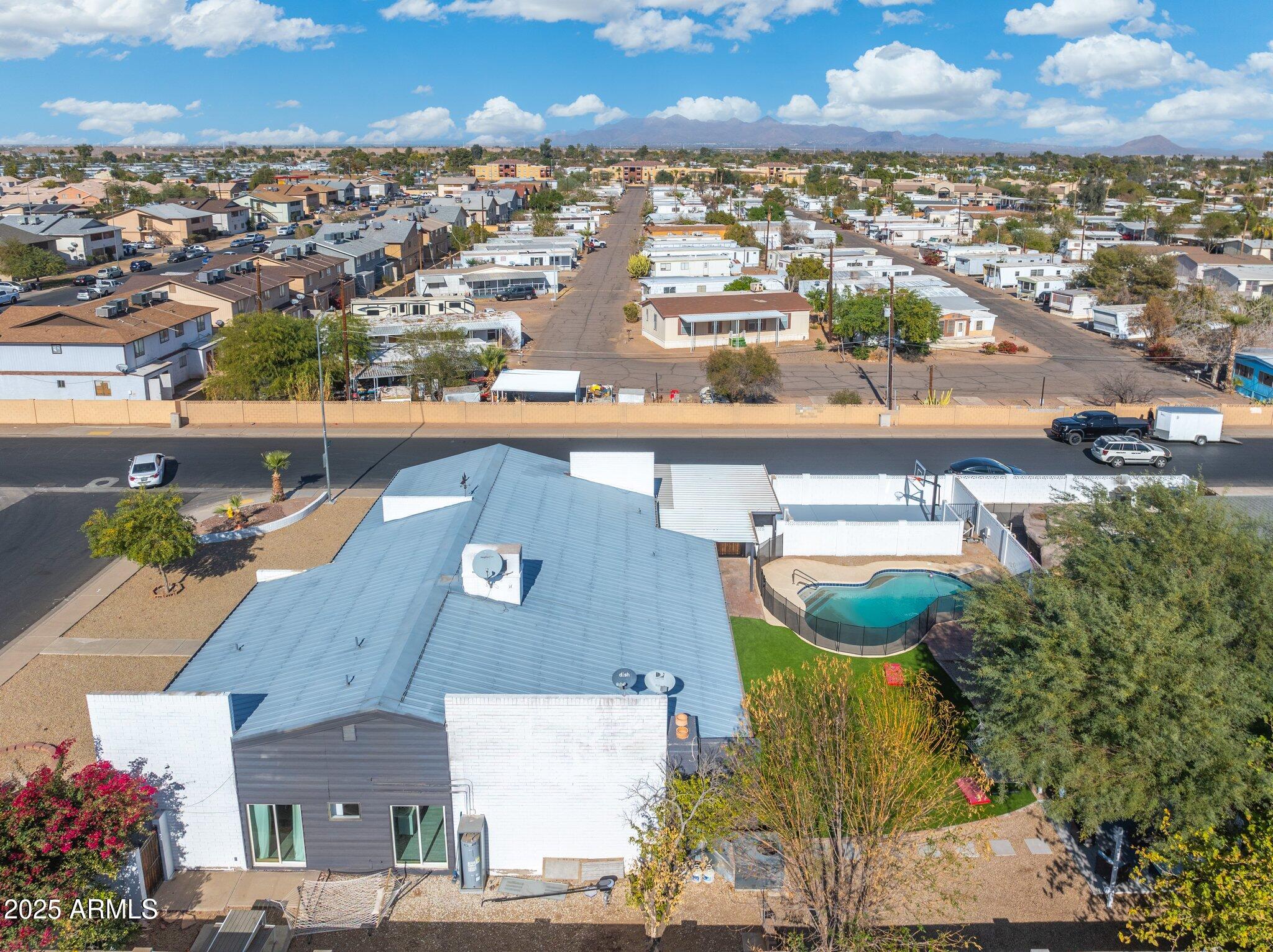 1759 North Spring Circle Mesa, AZ 85203 - Photo 10 of 69 an aerial view of residential houses with outdoor space and swimming pool