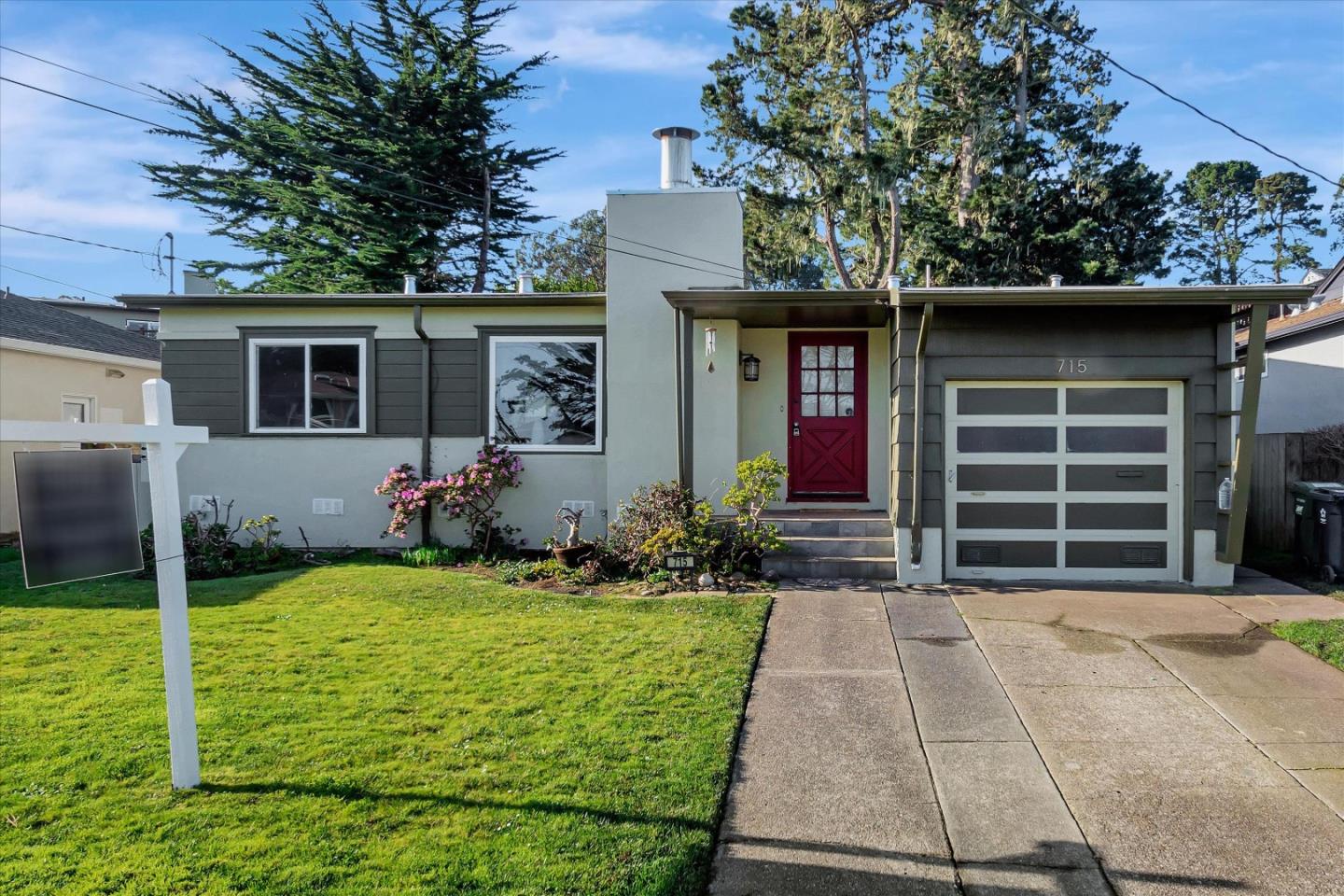 a house view with a garden space