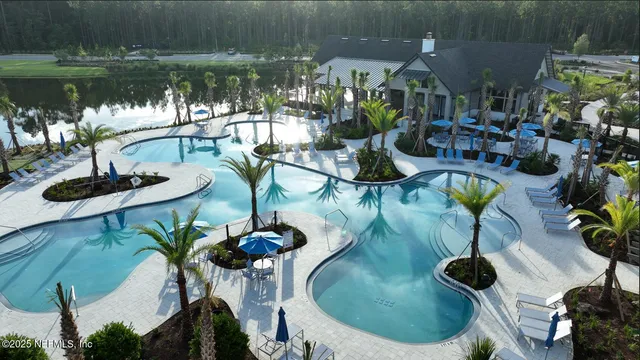 a view of pool table and chairs in patio