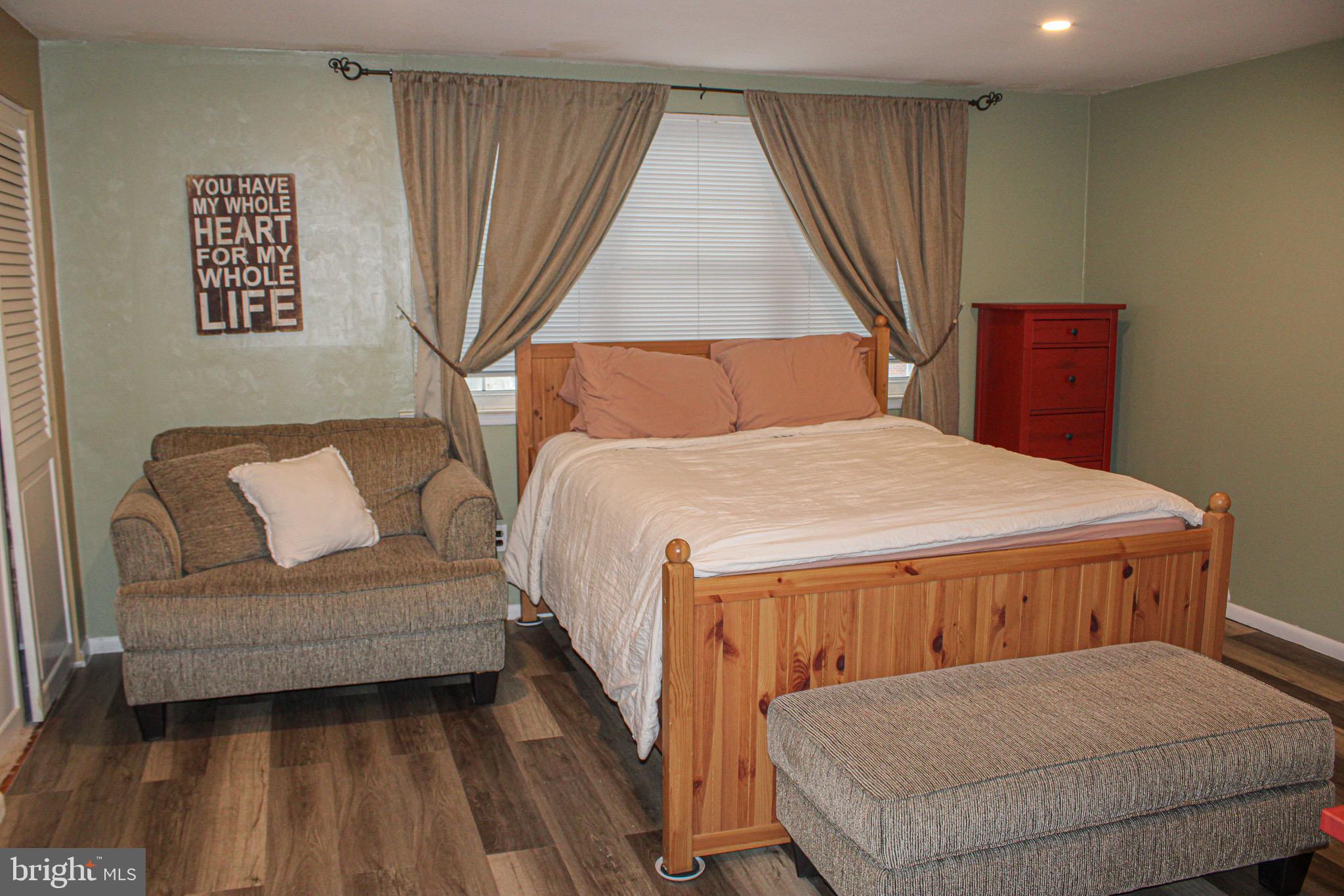 10830 Perrin Road Philadelphia, PA 19154 - Photo 13 of 24 a bedroom with a large bed couch and a window