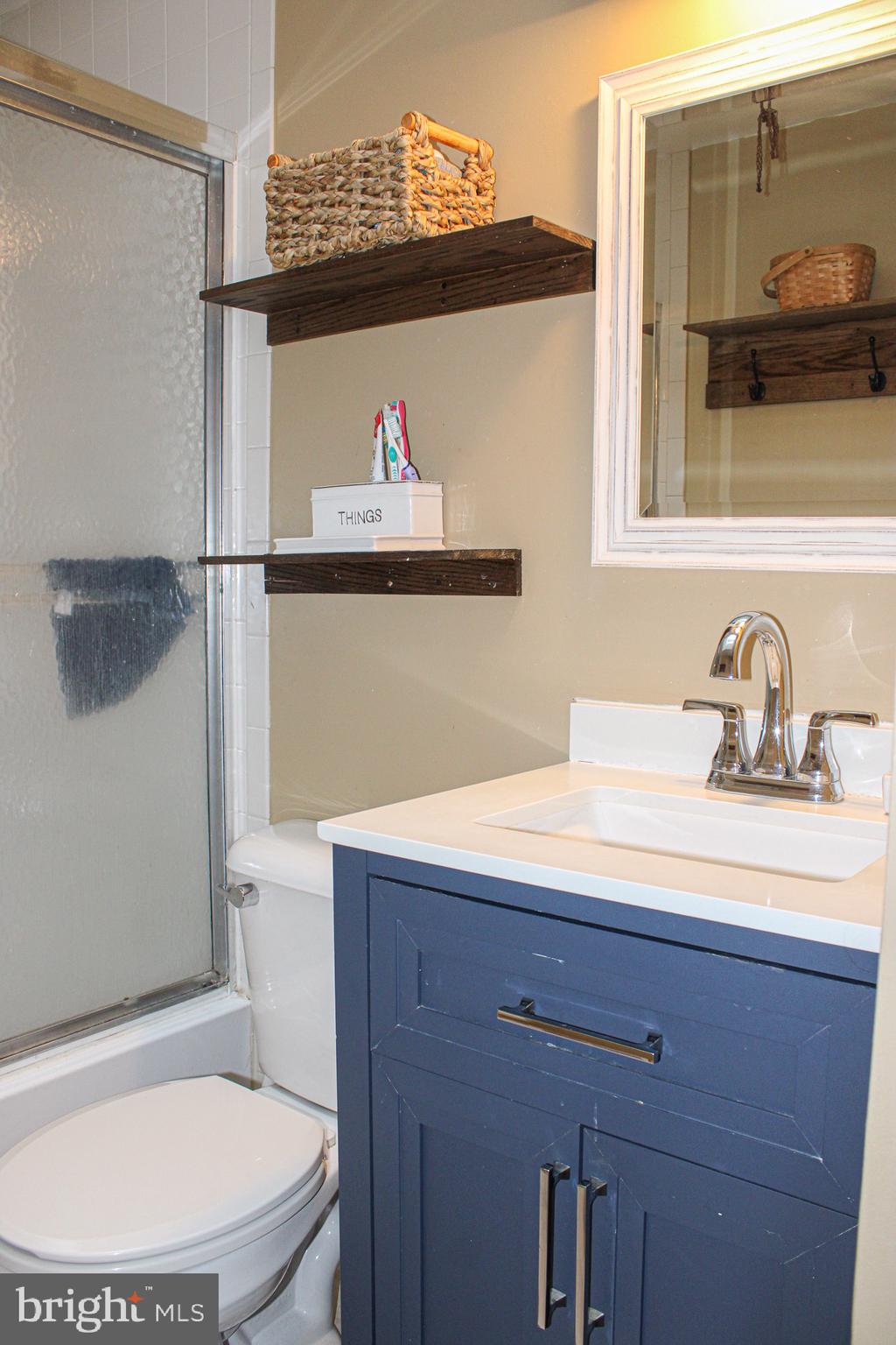 10830 Perrin Road Philadelphia, PA 19154 - Photo 16 of 24 a bathroom with a sink a toilet and shower
