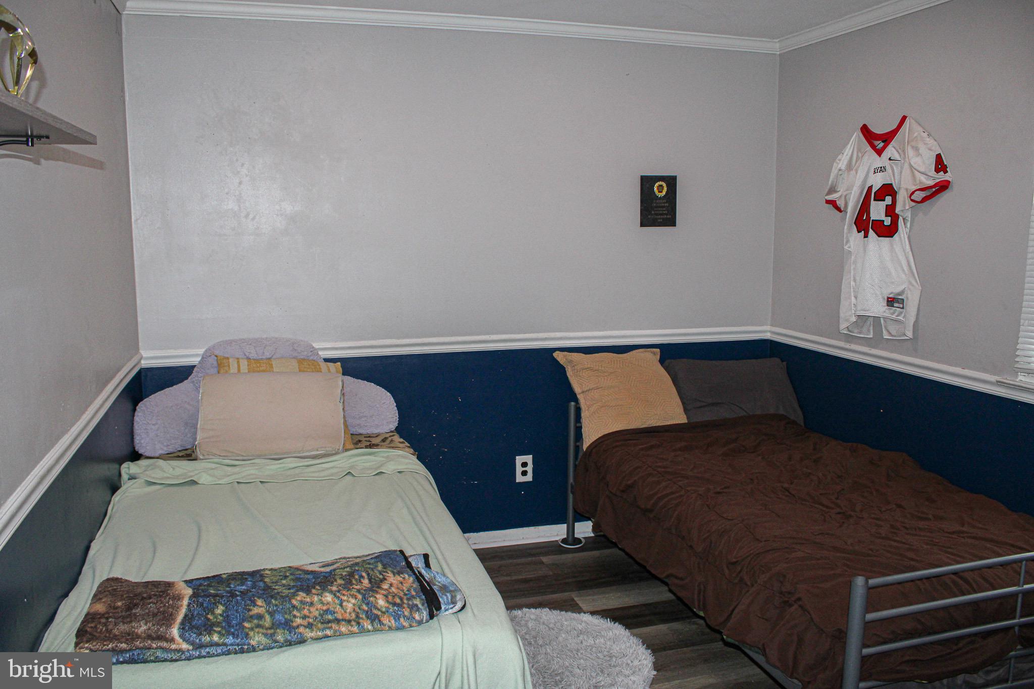 10830 Perrin Road Philadelphia, PA 19154 - Photo 17 of 24 a bedroom with a bed and a painting on the wall