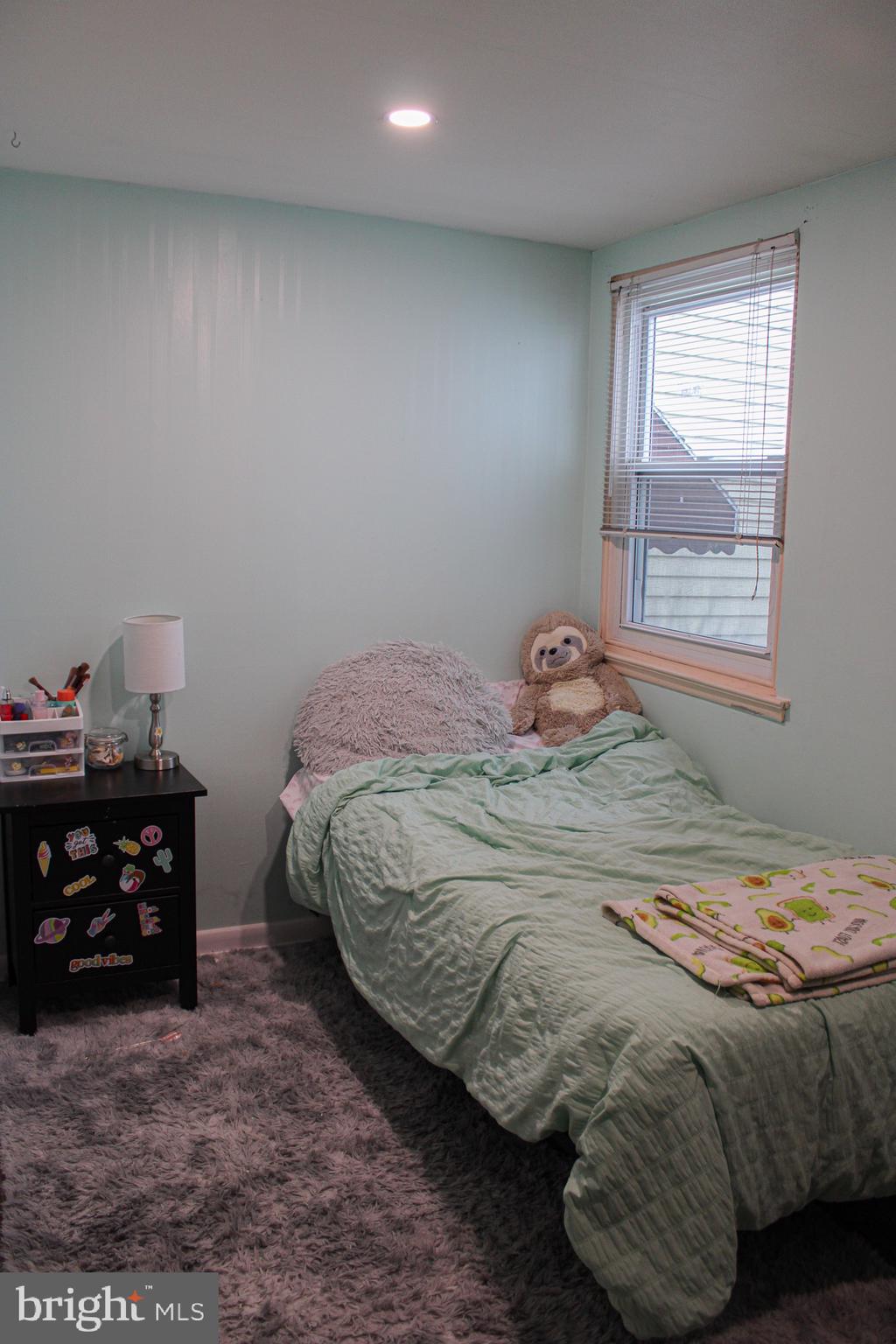 10830 Perrin Road Philadelphia, PA 19154 - Photo 19 of 24 a bedroom with a bed and a window