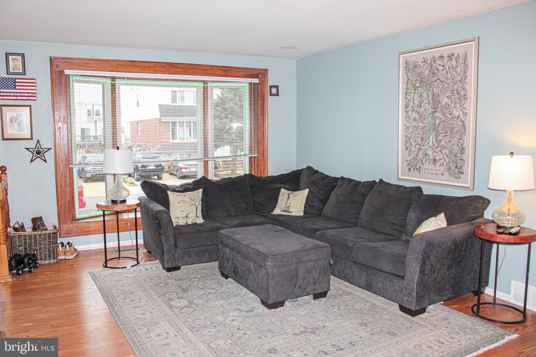 10830 Perrin Road Philadelphia, PA 19154 - Photo 2 of 24 a living room with furniture and a large window