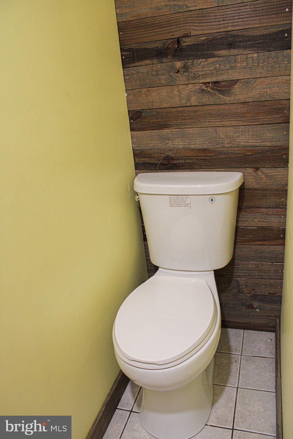 10830 Perrin Road Philadelphia, PA 19154 - Photo 23 of 24 a white toilet sitting next to a sink