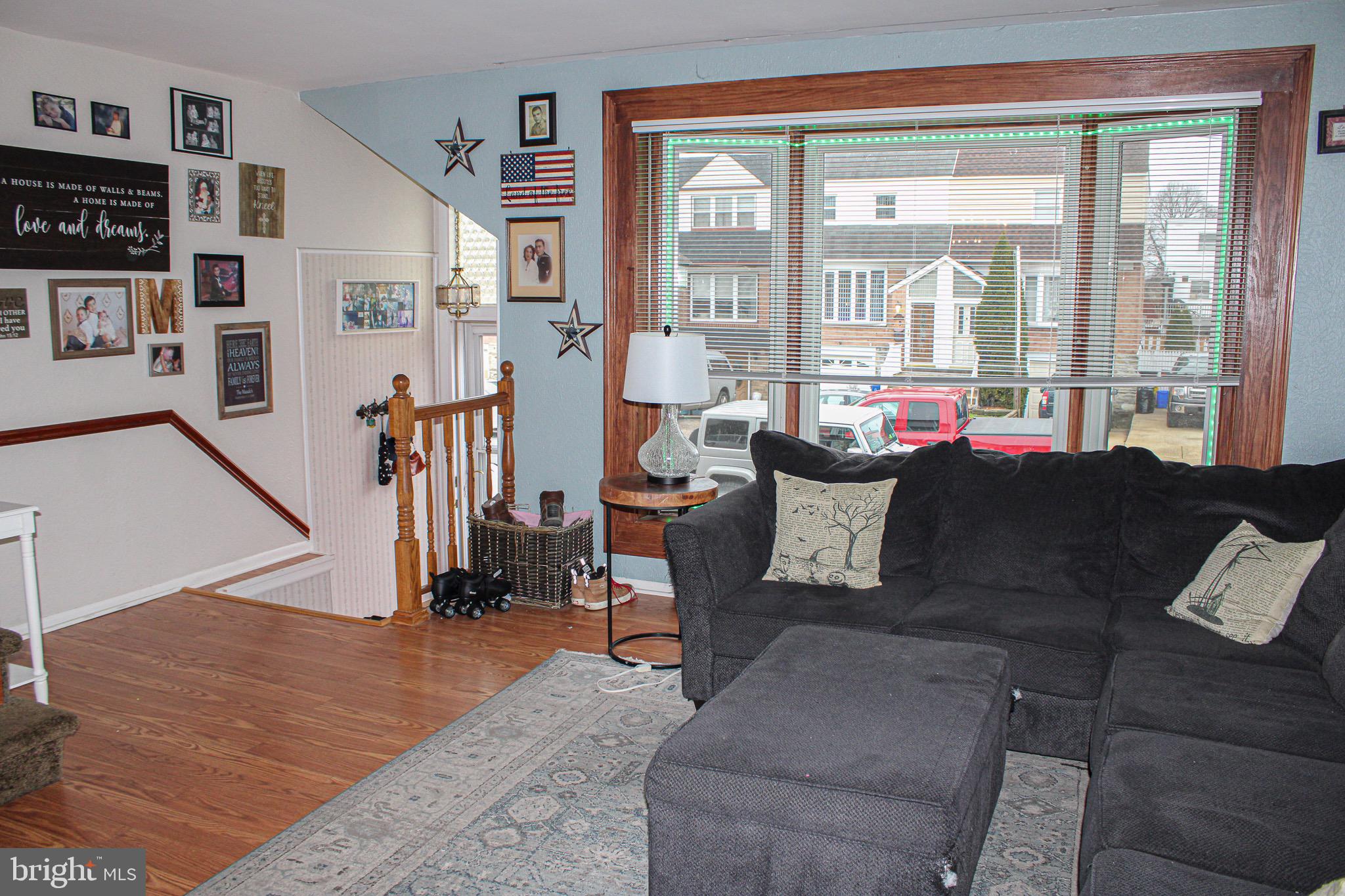10830 Perrin Road Philadelphia, PA 19154 - Photo 3 of 24 a living room with furniture and a floor to ceiling window