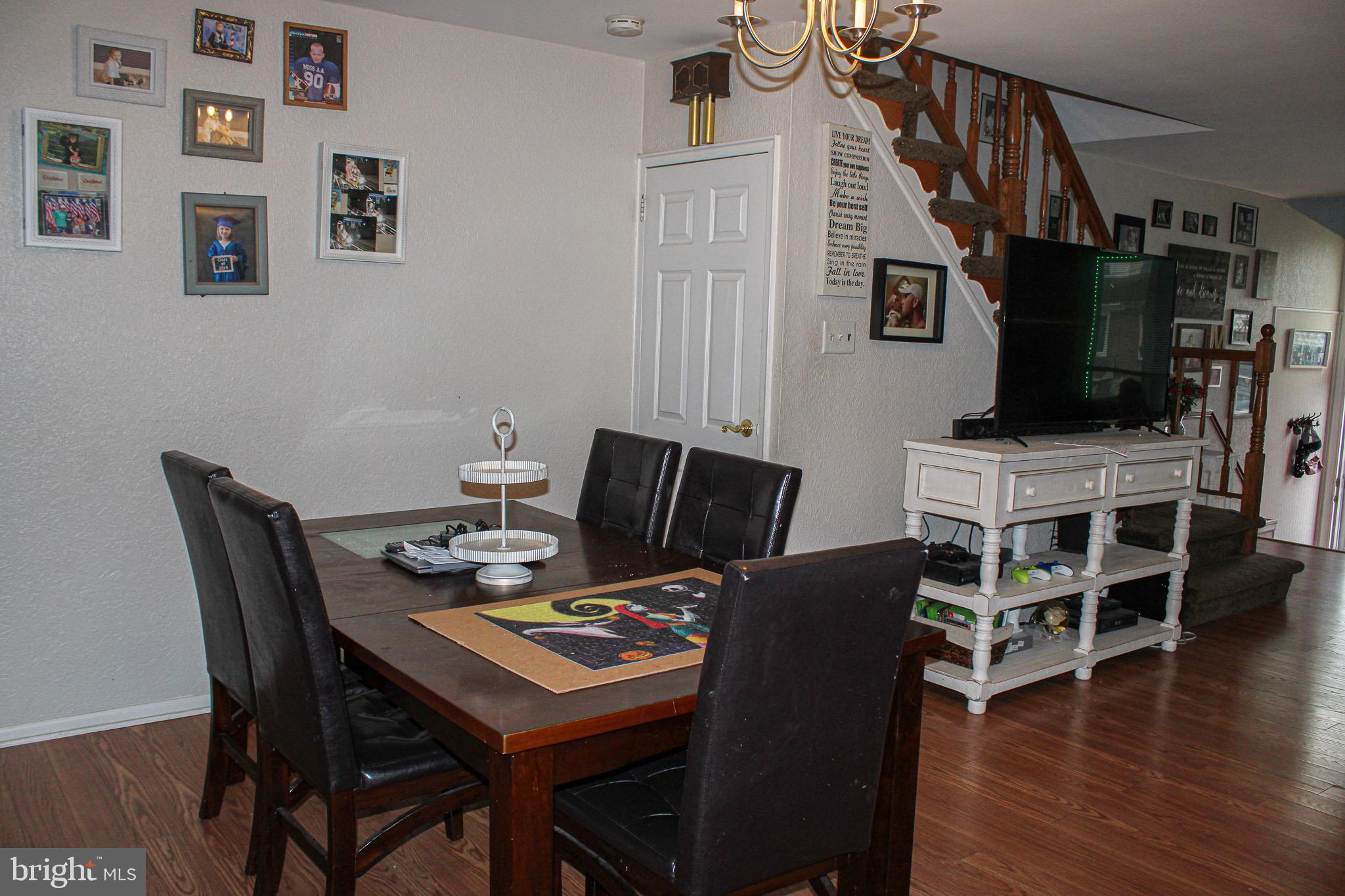 10830 Perrin Road Philadelphia, PA 19154 - Photo 5 of 24 a view of a dining room with furniture and wooden floor