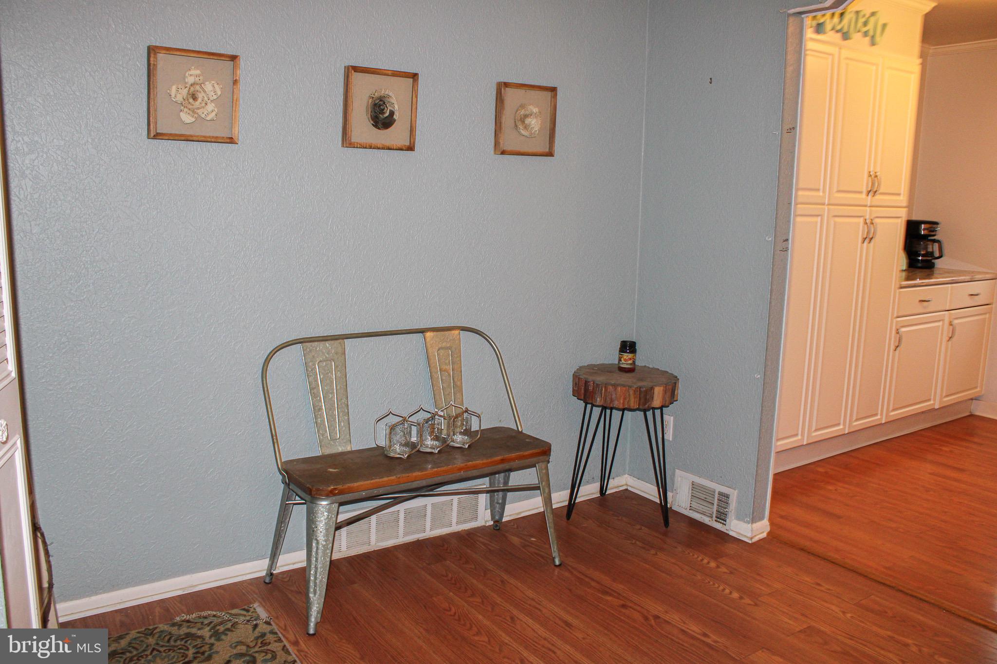 10830 Perrin Road Philadelphia, PA 19154 - Photo 6 of 24 a living room with furniture a table and wooden floor
