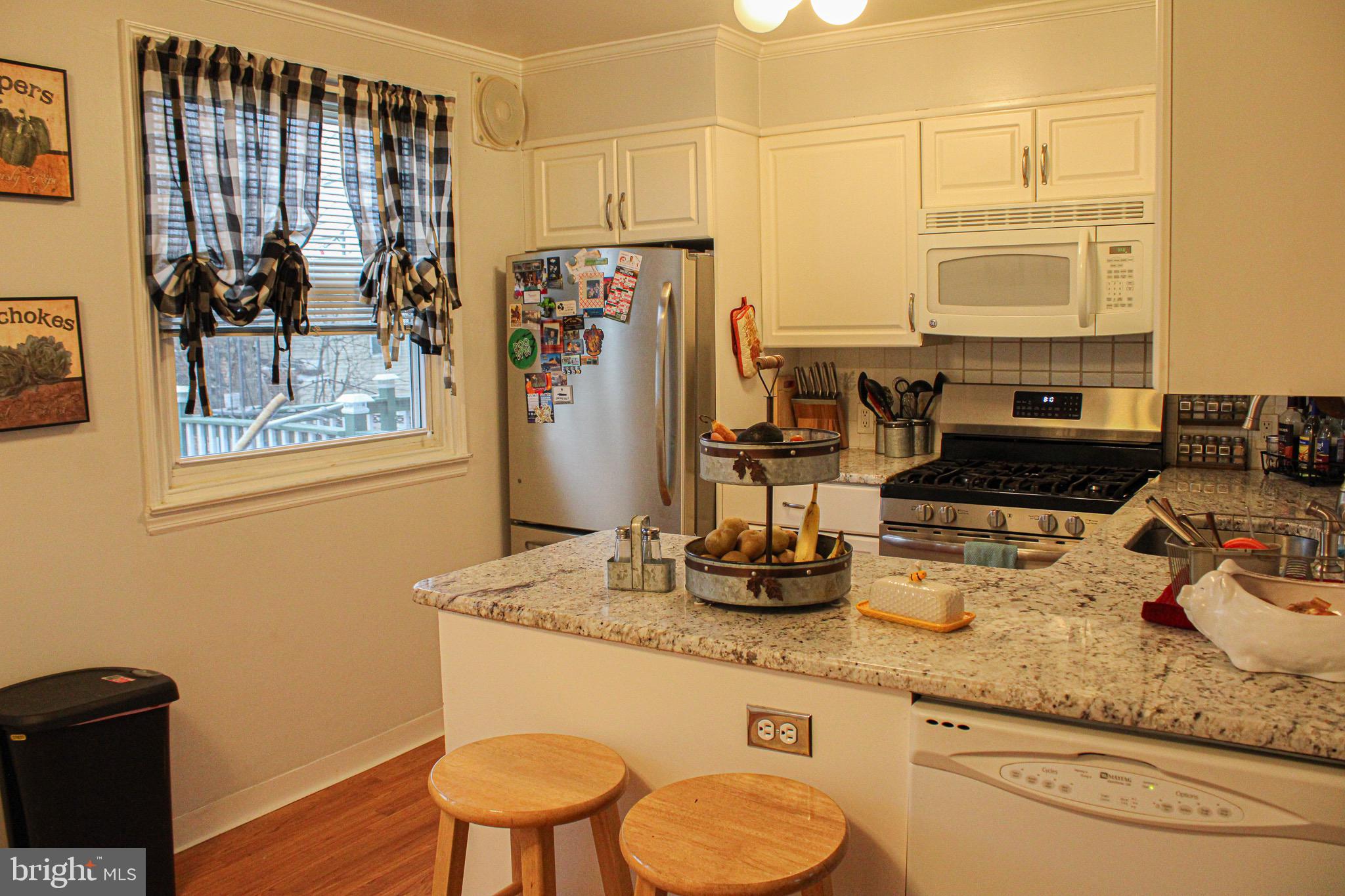 10830 Perrin Road Philadelphia, PA 19154 - Photo 7 of 24 a bathroom with a granite countertop sink a toilet and shower