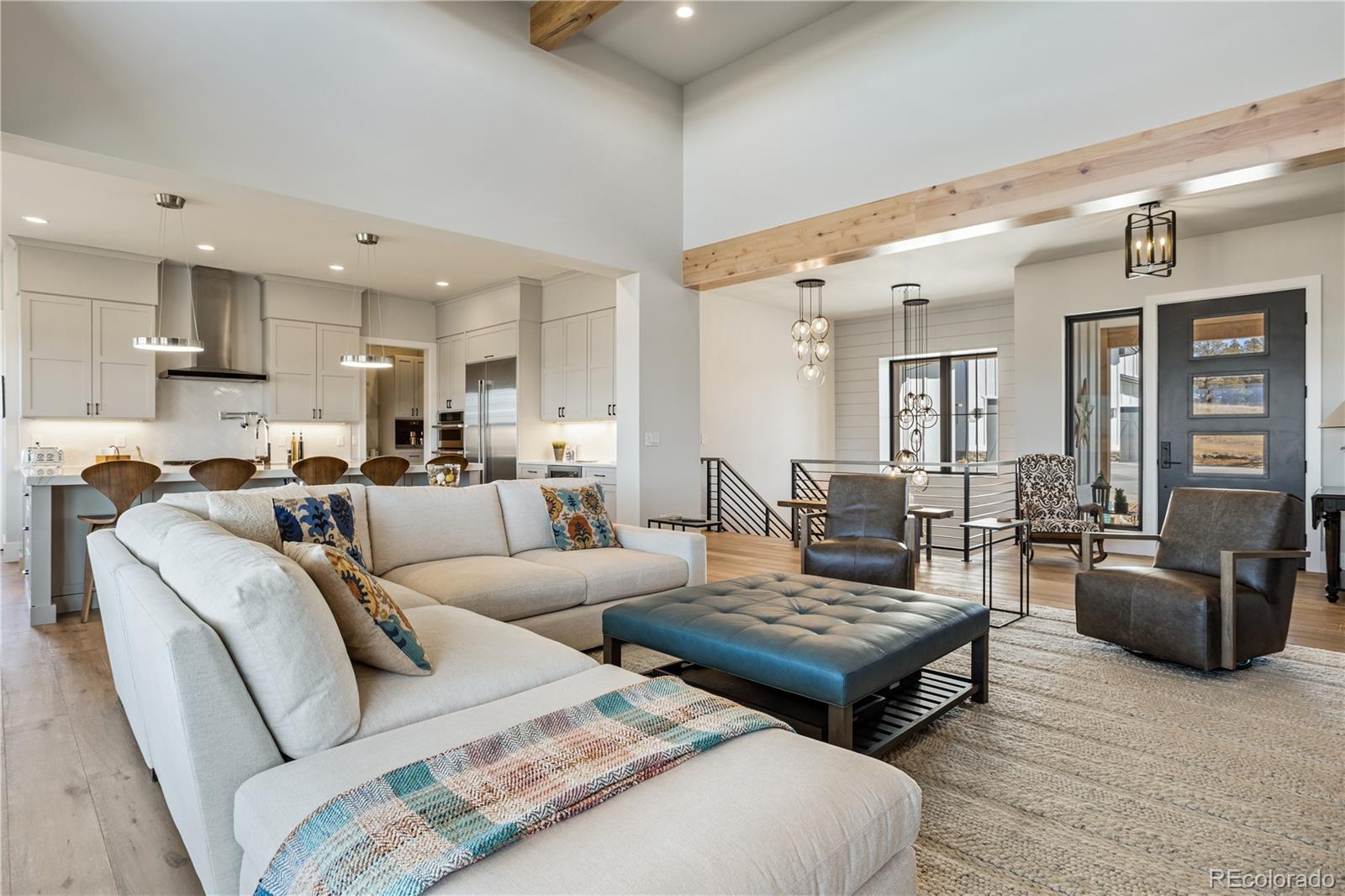 10621 Lone Fox Road Franktown, CO 80116 - Photo 12 of 50 a living room with furniture and wooden floor