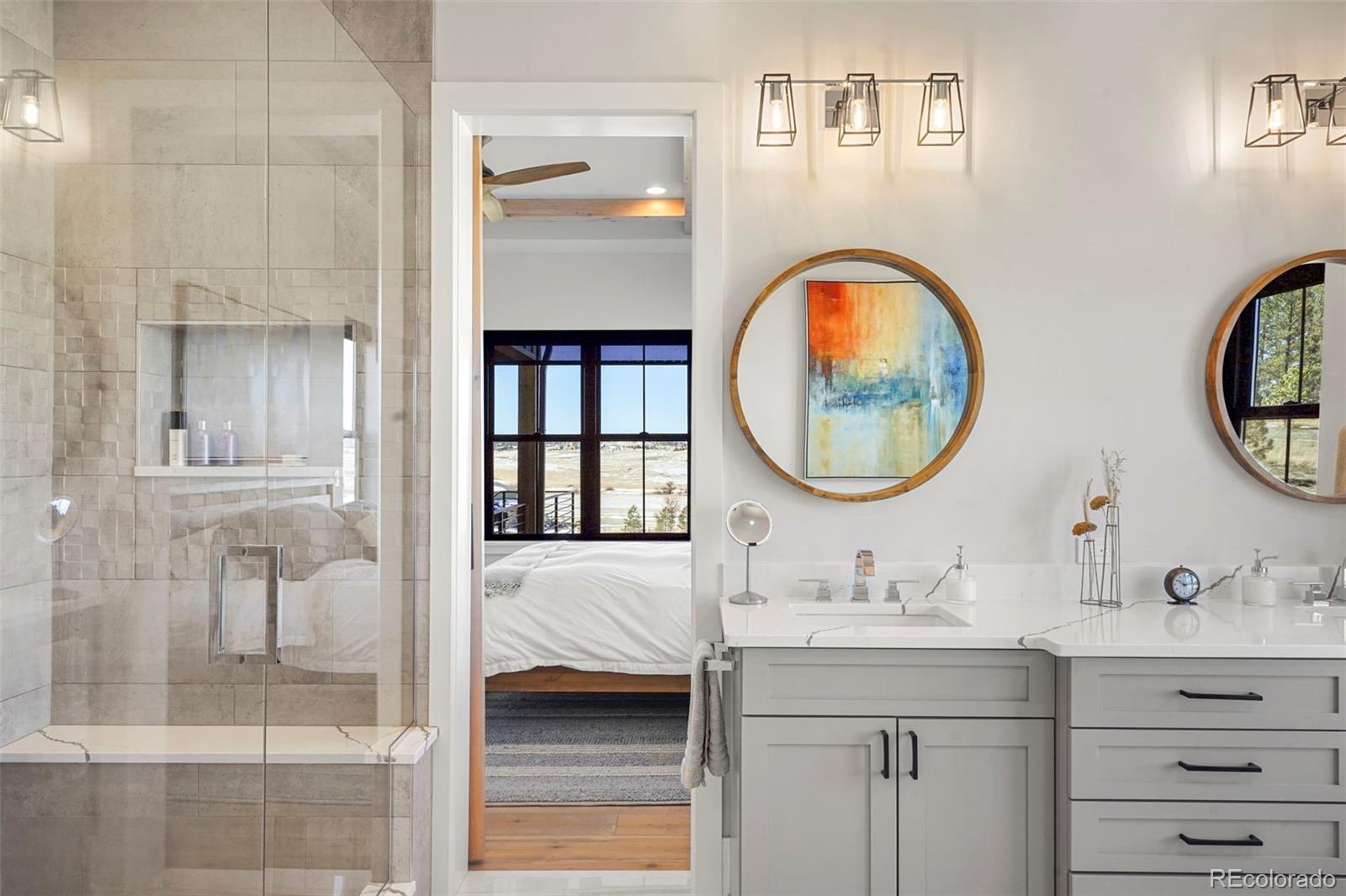 10621 Lone Fox Road Franktown, CO 80116 - Photo 26 of 50 a bathroom with a sink and a mirror