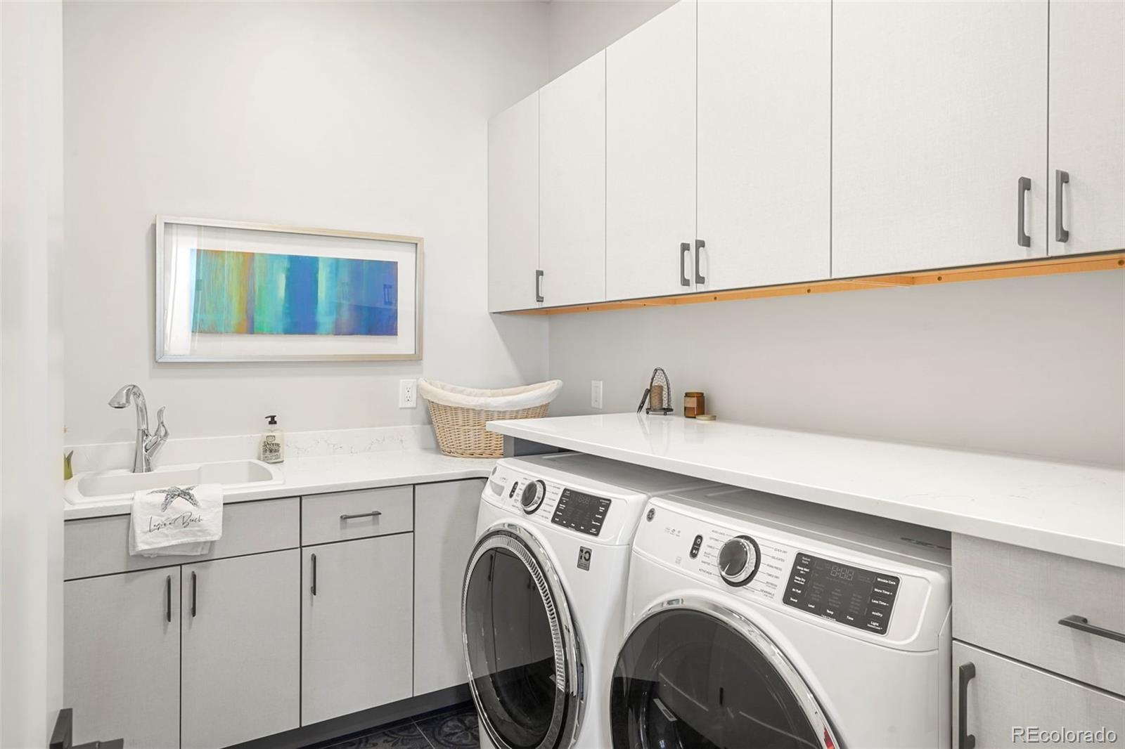 10621 Lone Fox Road Franktown, CO 80116 - Photo 29 of 50 a utility room with dryer and washer