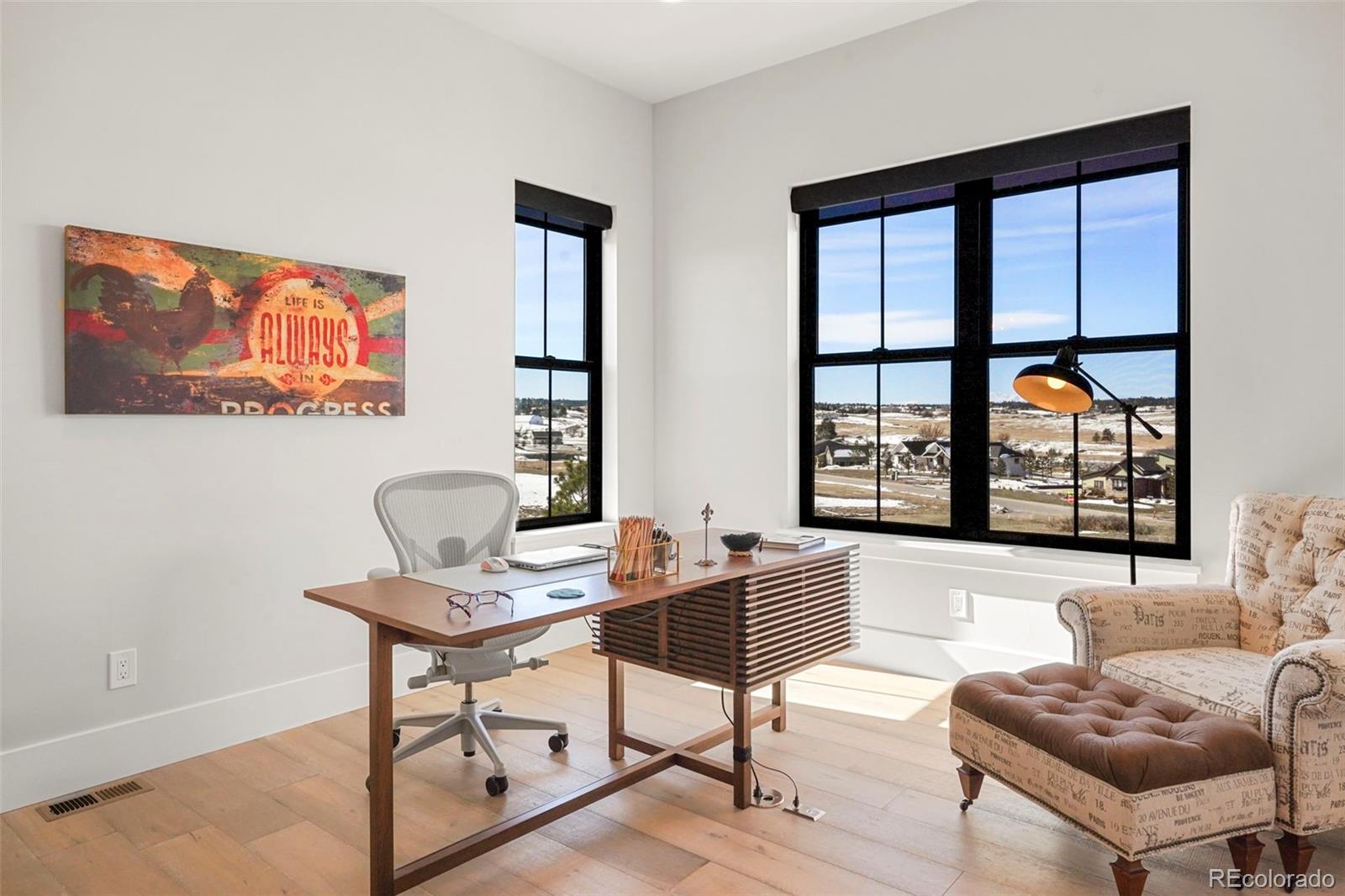 10621 Lone Fox Road Franktown, CO 80116 - Photo 31 of 50 a living room with furniture and a window