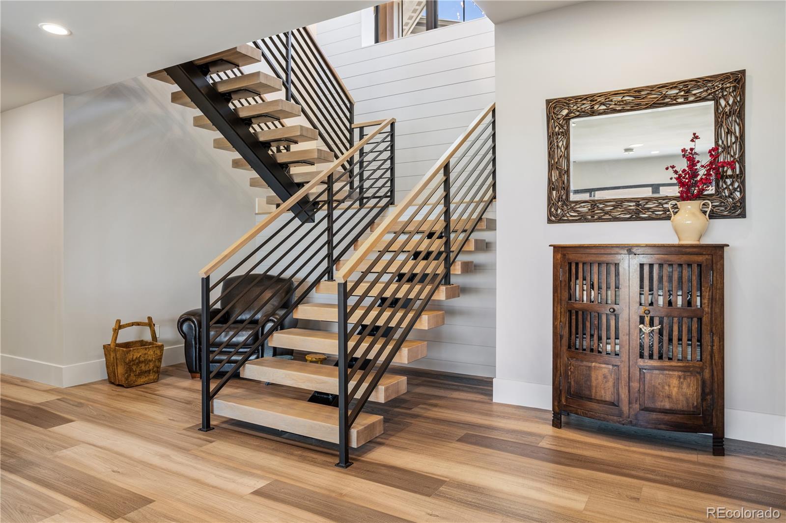 10621 Lone Fox Road Franktown, CO 80116 - Photo 34 of 50 a living room with furniture and a flat screen tv