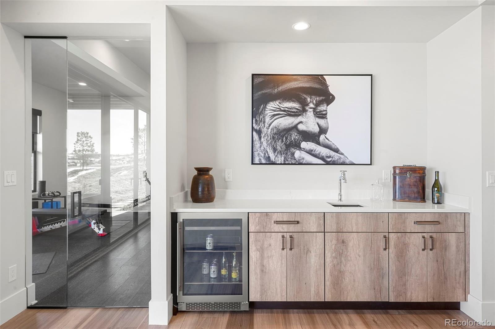 10621 Lone Fox Road Franktown, CO 80116 - Photo 37 of 50 a living room with furniture and a large window