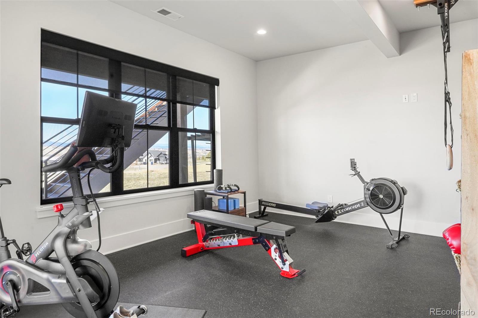 10621 Lone Fox Road Franktown, CO 80116 - Photo 39 of 50 a view of a room with gym equipment