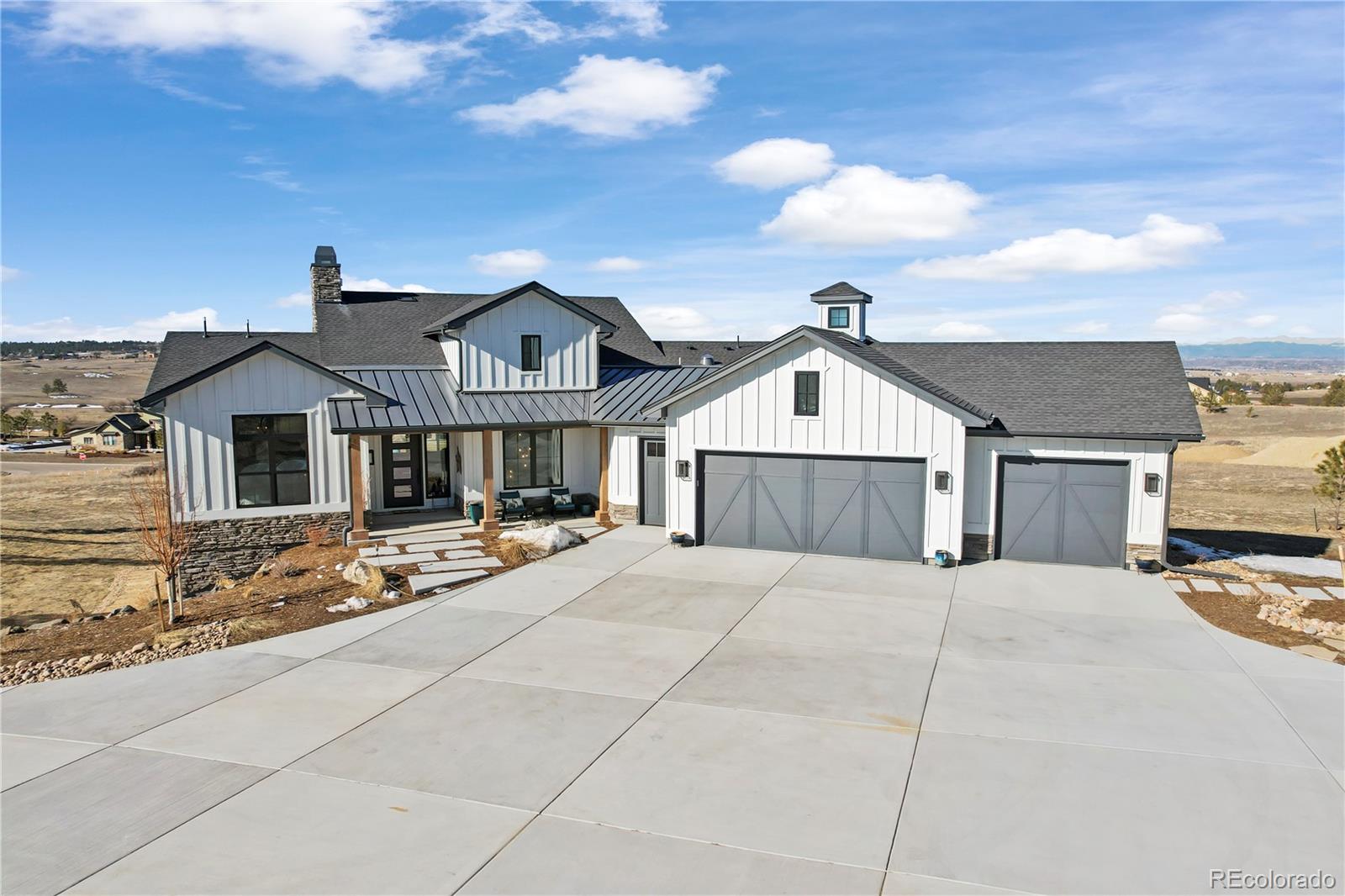 10621 Lone Fox Road Franktown, CO 80116 - Photo 50 of 50 a view of house with yard in front of it