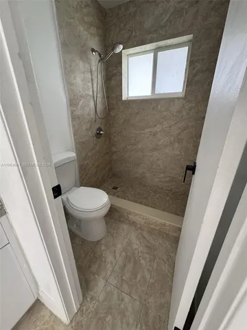 a bathroom with a sink and toilet